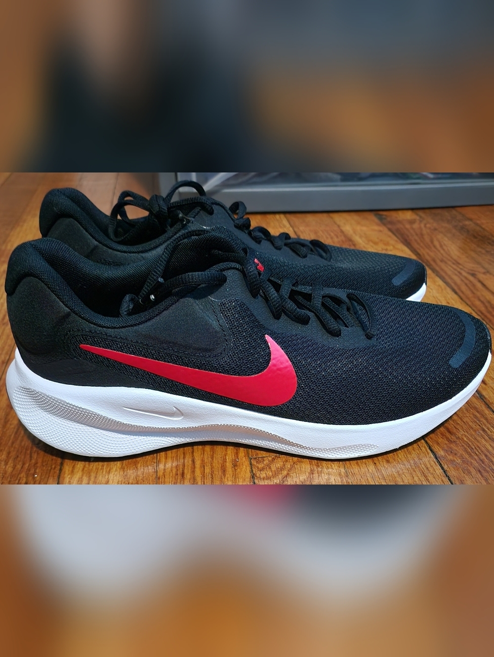 Nike Black Athletic Sneakers with Red Swoosh and White Sole